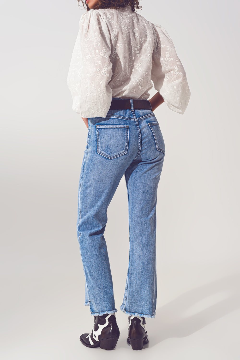 Flared Jeans in Light Blue With Asymmetric Hem